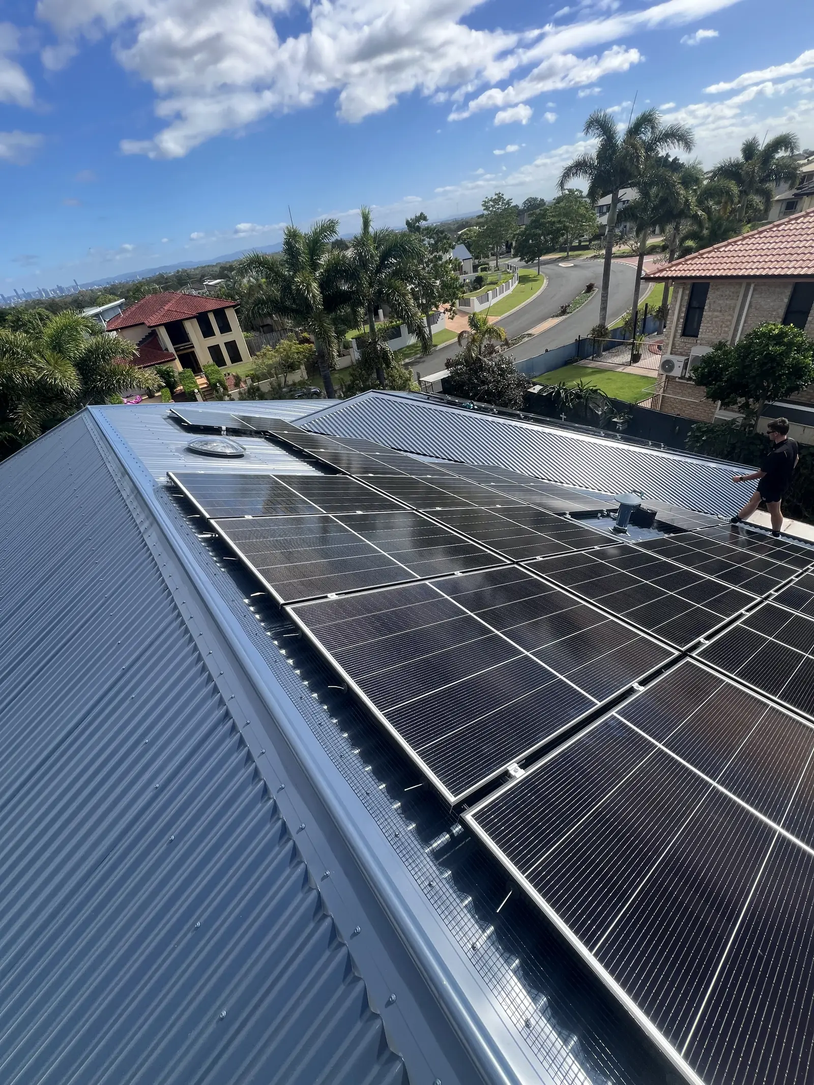 Rooftop solar array with the street and neighbouring homes visible below
