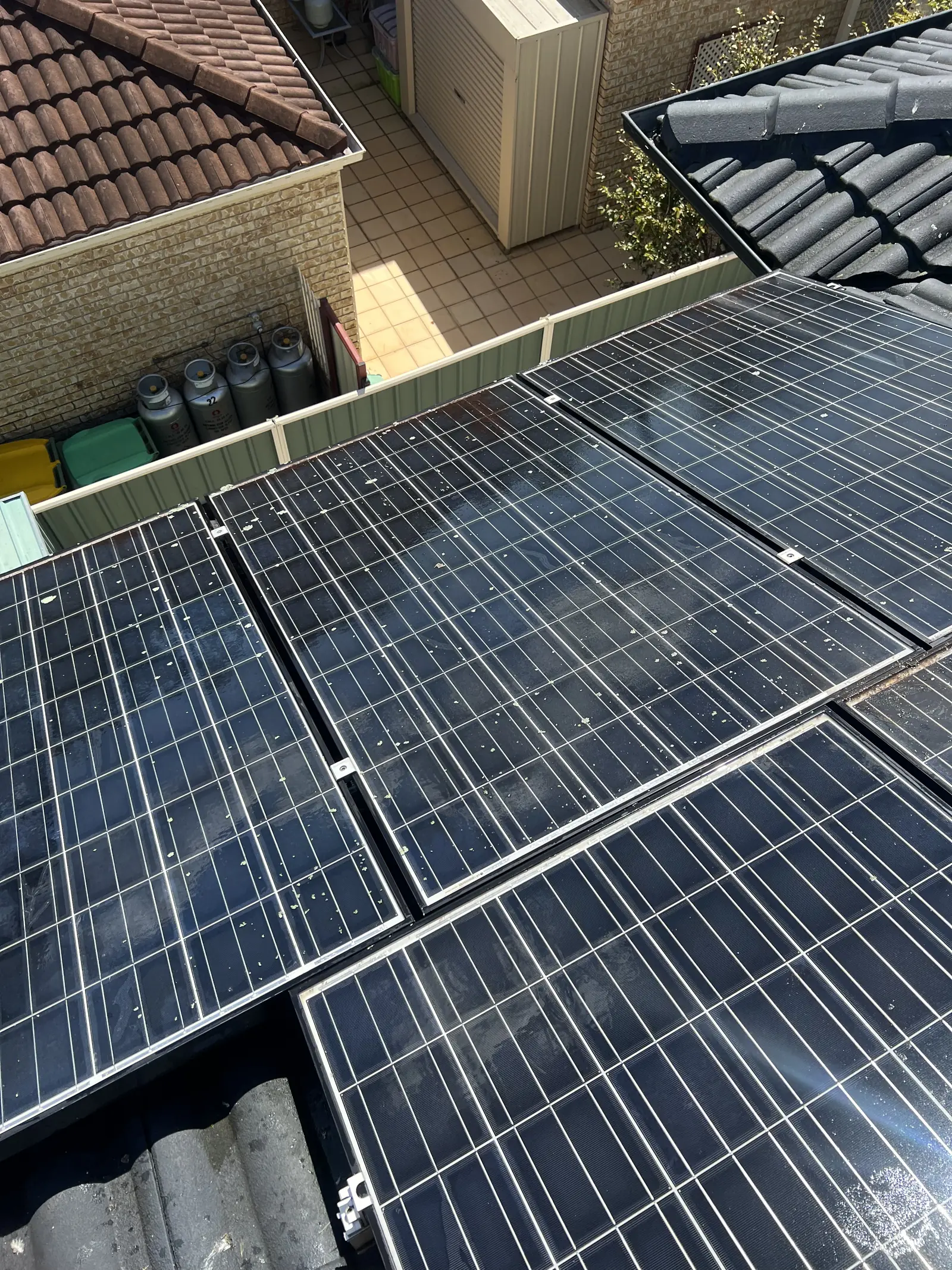 Solar panels marked with bird droppings and debris